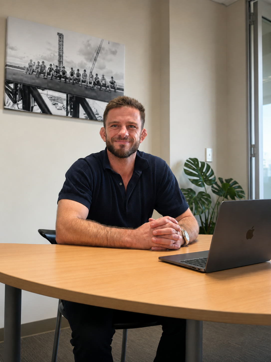 Sebastian Ortiz seated at a desk in his office